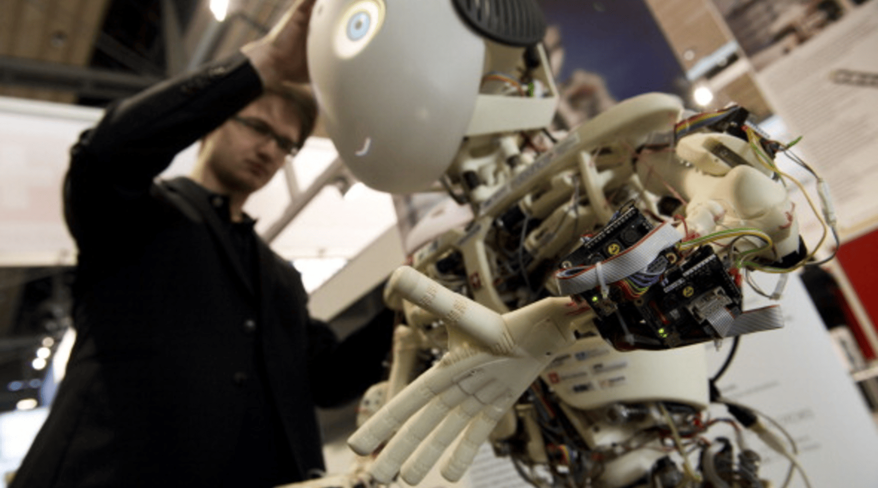An engineer inspects Roboy, a humanoid robot developed at the Artificial Intelligence Laboratory of the University of Zurich.