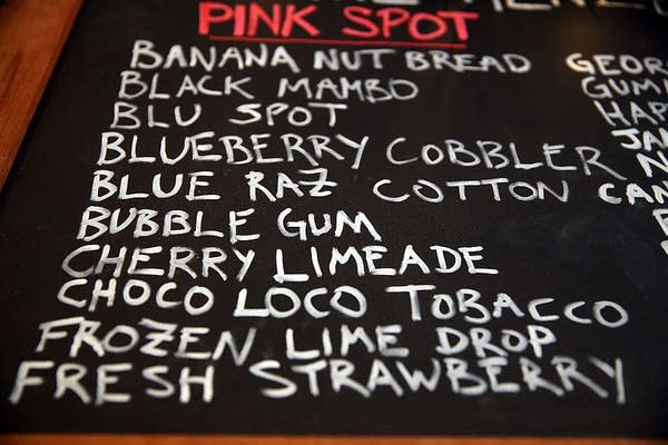 NEW YORK, NY - DECEMBER 19: Different flavors for vaping pipes, or electronic cigarettes, are viewed for sale on a blackboard at the newly opened Henley Vaporium, on December 19, 2013 in New York City.