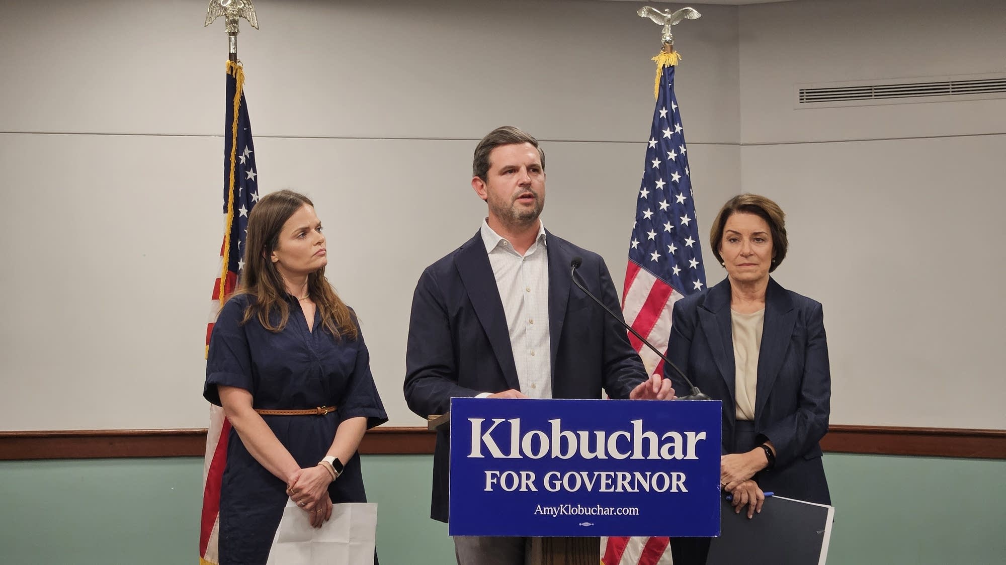 Jackie Flavin and Mike Moyski, the parents of 10-year-old Harper Moyski who was killed in the mass shooting at Annunciation Catholic Church and School, stand by Democratic nominee for governor Amy Klobuchar as they endorse her on Thursday.Feven Gerezgiher | MPR News