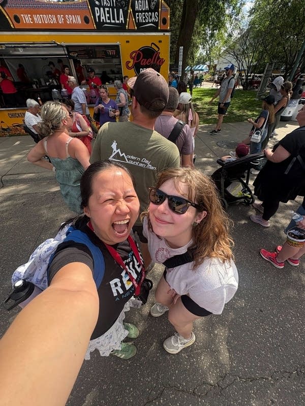 Two women pose for a selfie