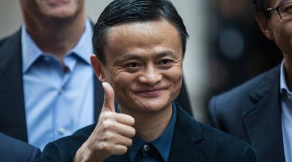 Executive Chairman of Alibaba Group Jack Ma poses for a photo outside the New York Stock Exchange. 
