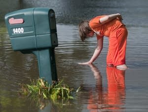 Logan Krevchuck, 14, puts his hand in a whirlpool.