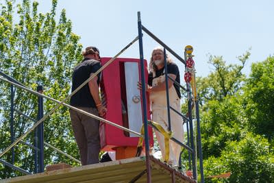 Thousands celebrate the 5th giant pencil sharpening on Lake of the Isles