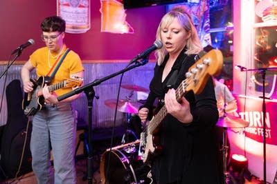 Band performing by window