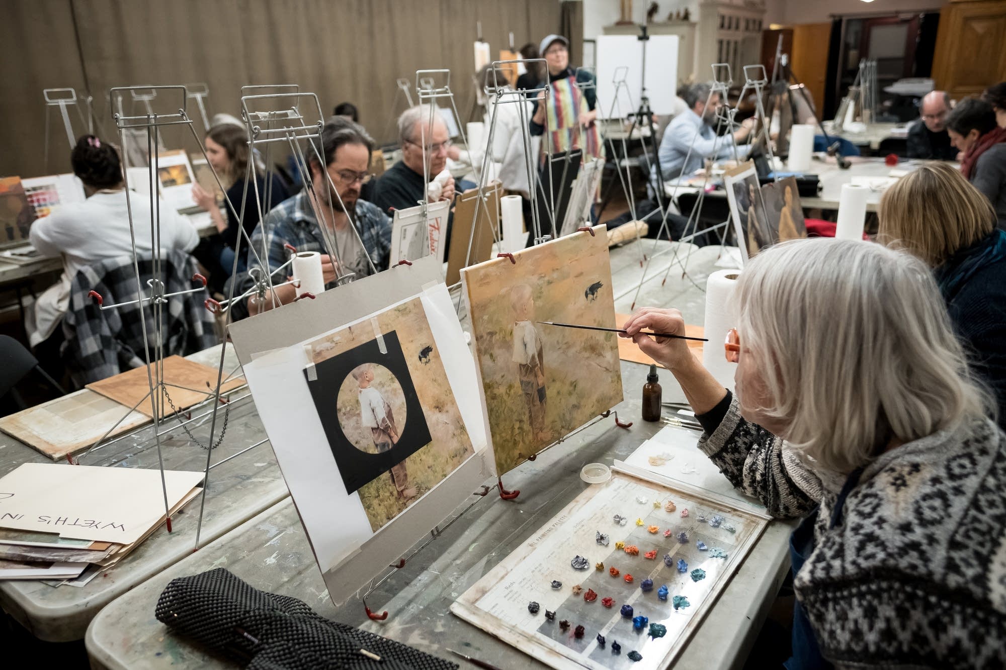 Students take an adult painting class.