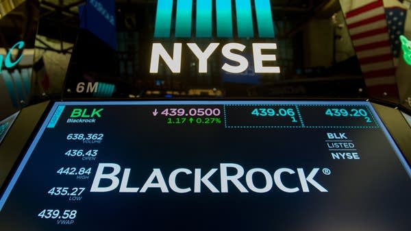 The trading symbol for BlackRock is displayed at the closing bell of the Dow Industrial Average at the New York Stock Exchange on July 14, 2017 in New York. 