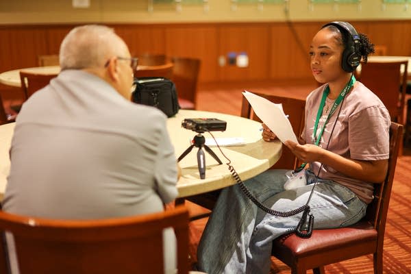 A girl interviews someone