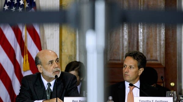 Federal Reserve Board Chairman Ben Bernanke (L) speaks during an open meeting of the Financial Stability Oversight Council with U.S. Treasury Secretary Timothy Geithner at the Treasury Department Oct. 11, 2011 in Washington, D.C.