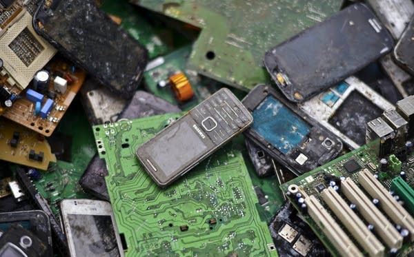 LUENEN, GERMANY - FEBRUARY 07:  Old mobile phones lie between electronic components including circuit boards sit in a pile ahead of recycling at Aurubis AG metal refinery on February 7, 2014 in Luenen, Germany. Aurubis is Germany's biggest recycler of scrap electronics and extracts metals including copper and gold from chips, hard drives, mobile phones, computers and other electronics devices. Recycling of electronic scrap is gaining in importance as worldwide supplies of metals, especially rare metals such as platinum, silver, tantalum and gold, become increasingly scarce. 