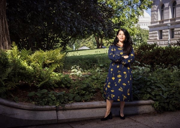 Ada Limón stands in front of Library of Congress and U.S. Capitol