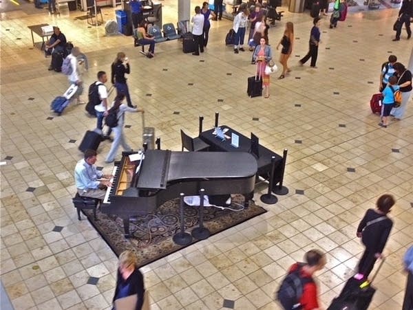 Poster One of the pianos at Minneapolis-St. Paul International Airport