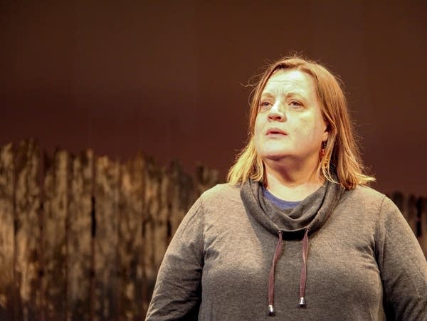 A women in acting in a play