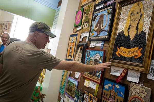 Gov. Walz touches a crop art