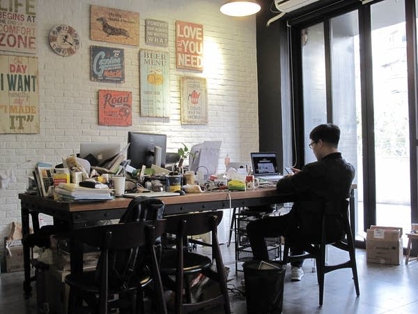 A man sits in his office.