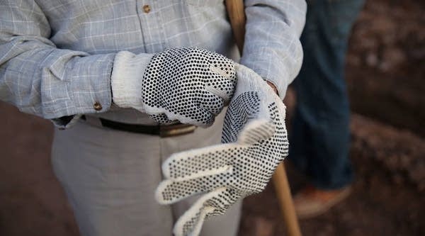 Mexican agricultural workers prepare to start a shift on a lettuce farm in Holtville, California.  