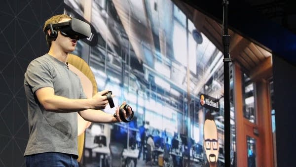 Facebook co-founder and chief executive, Mark Zuckerberg, speaks at an Oculus developers conference while wearing a virtual reality headset in San Jose, California on October 6, 2016.