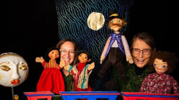 Monica Leo (right) poses next to her co-puppeteer, Stephanie Vallez (left). 