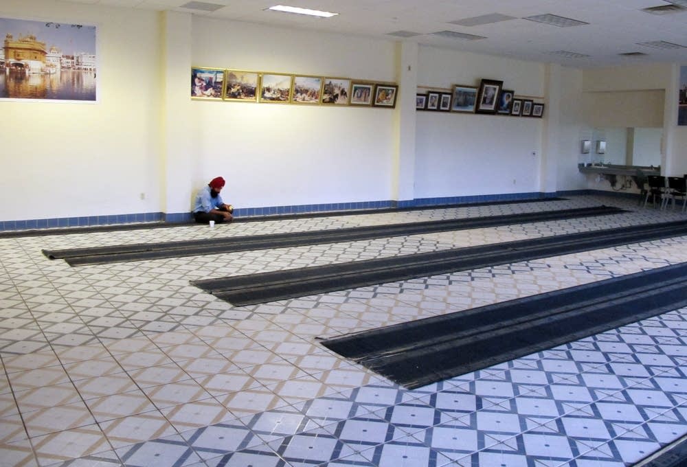 Lone worshipper at Sikh Temple