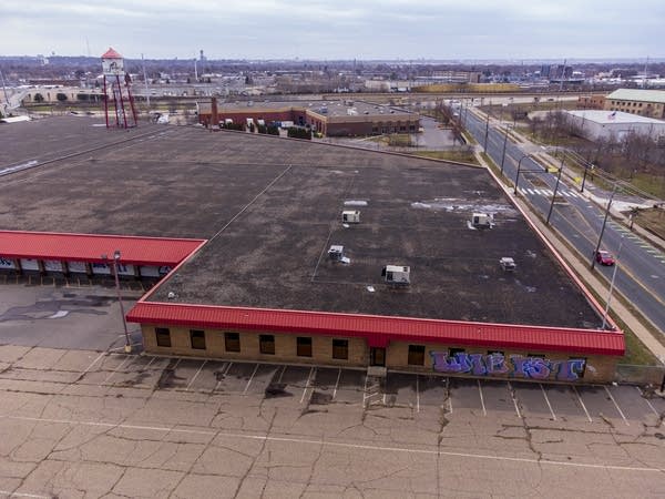 People hold signs and speak during an Earth Day march