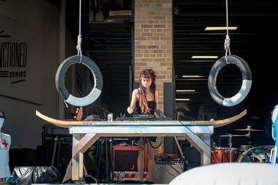 a person djing at an outdoor event