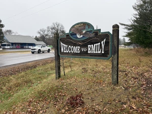 a sign reads welcome to emily