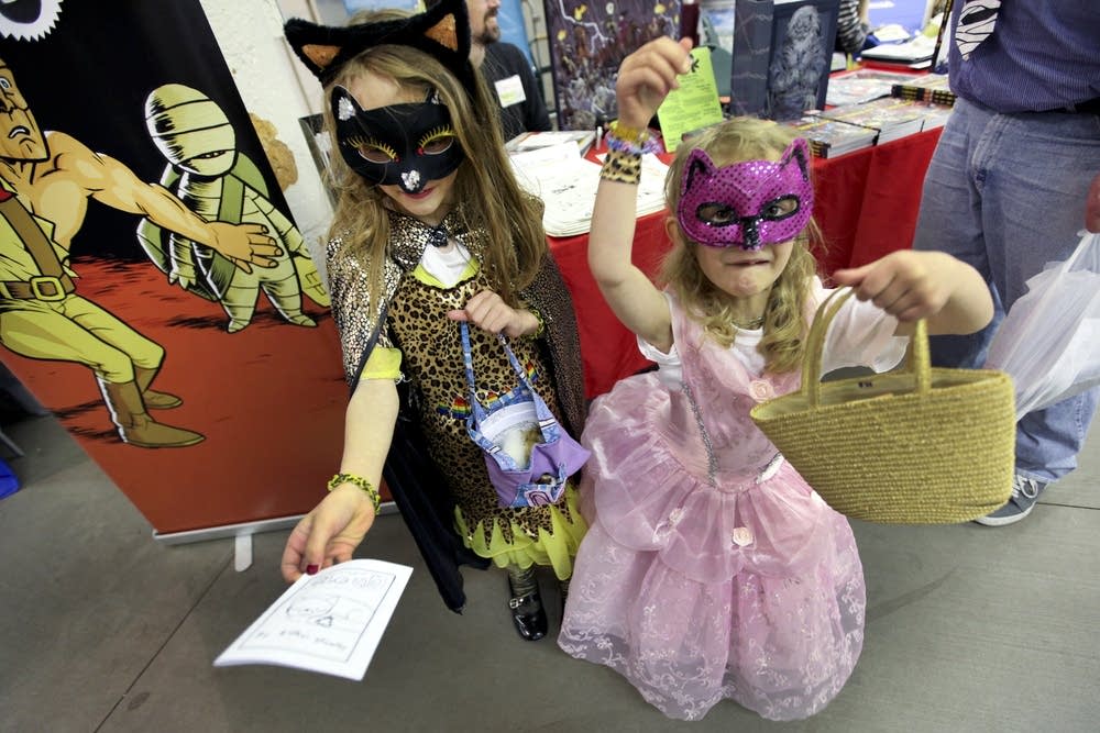 Supercat and Pinky hand out comics they wrote.