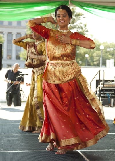 A group of dancers perform in unison