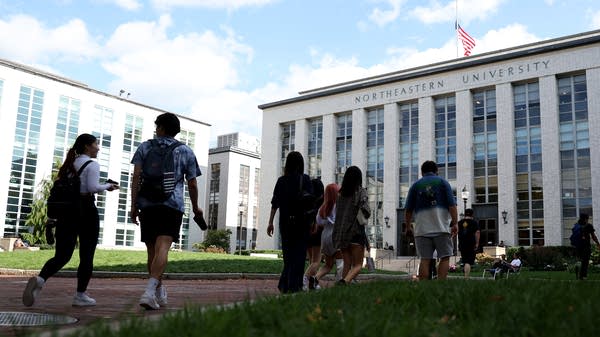 People walk on the Northeastern University campus.