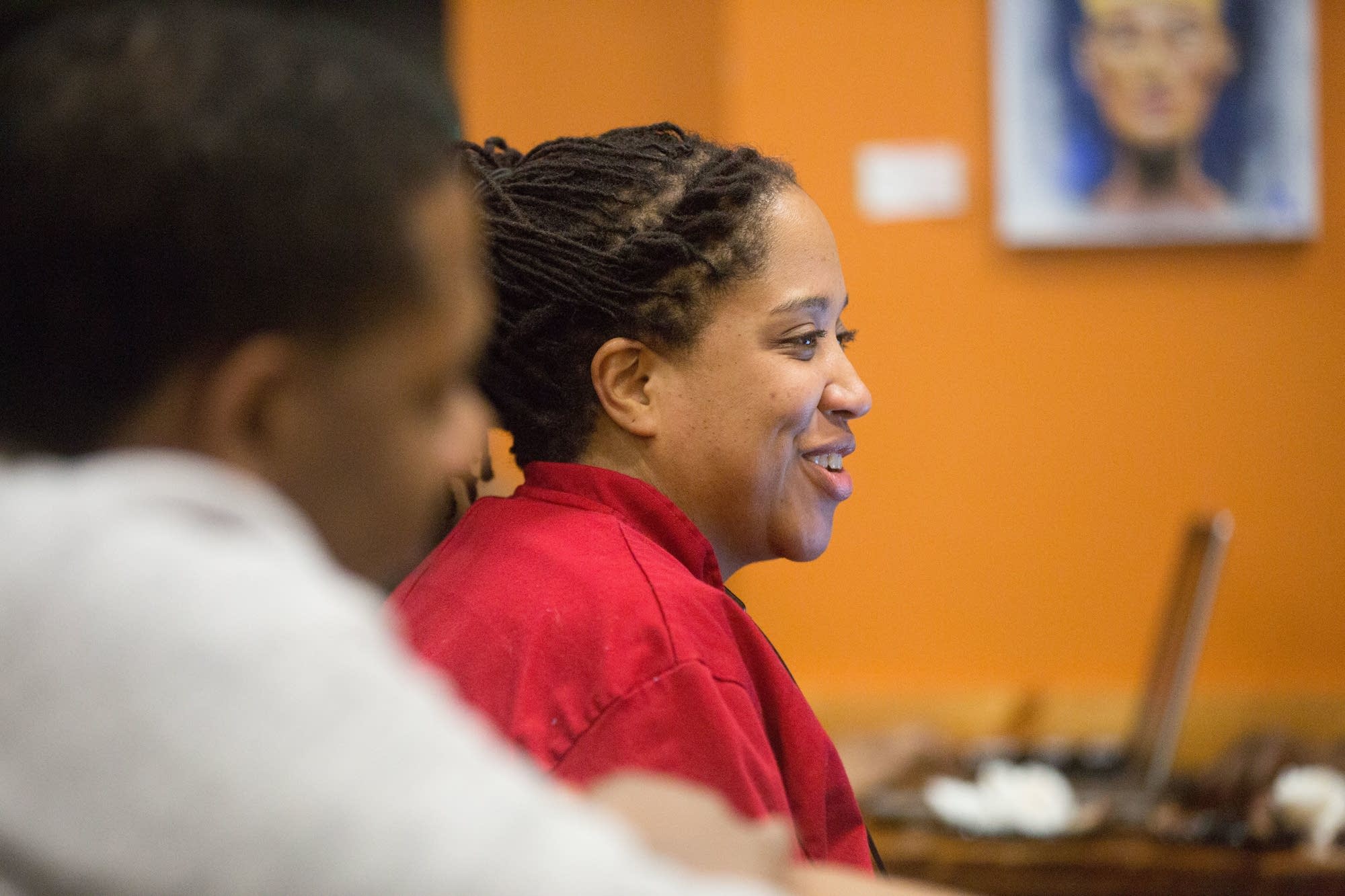 Lachelle Pacini goes over details with other members collective.