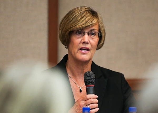 Candidate Kim Norton speaks during a forum.