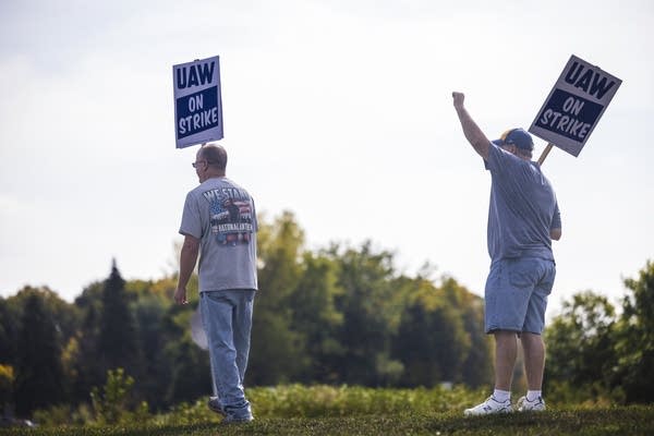 United Auto Workers members picket outside