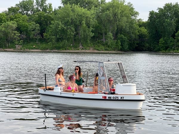 women in hot tub boat
