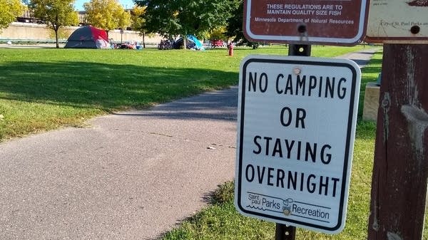 Homeless people camped along the Mississippi River near downtown St. Paul.