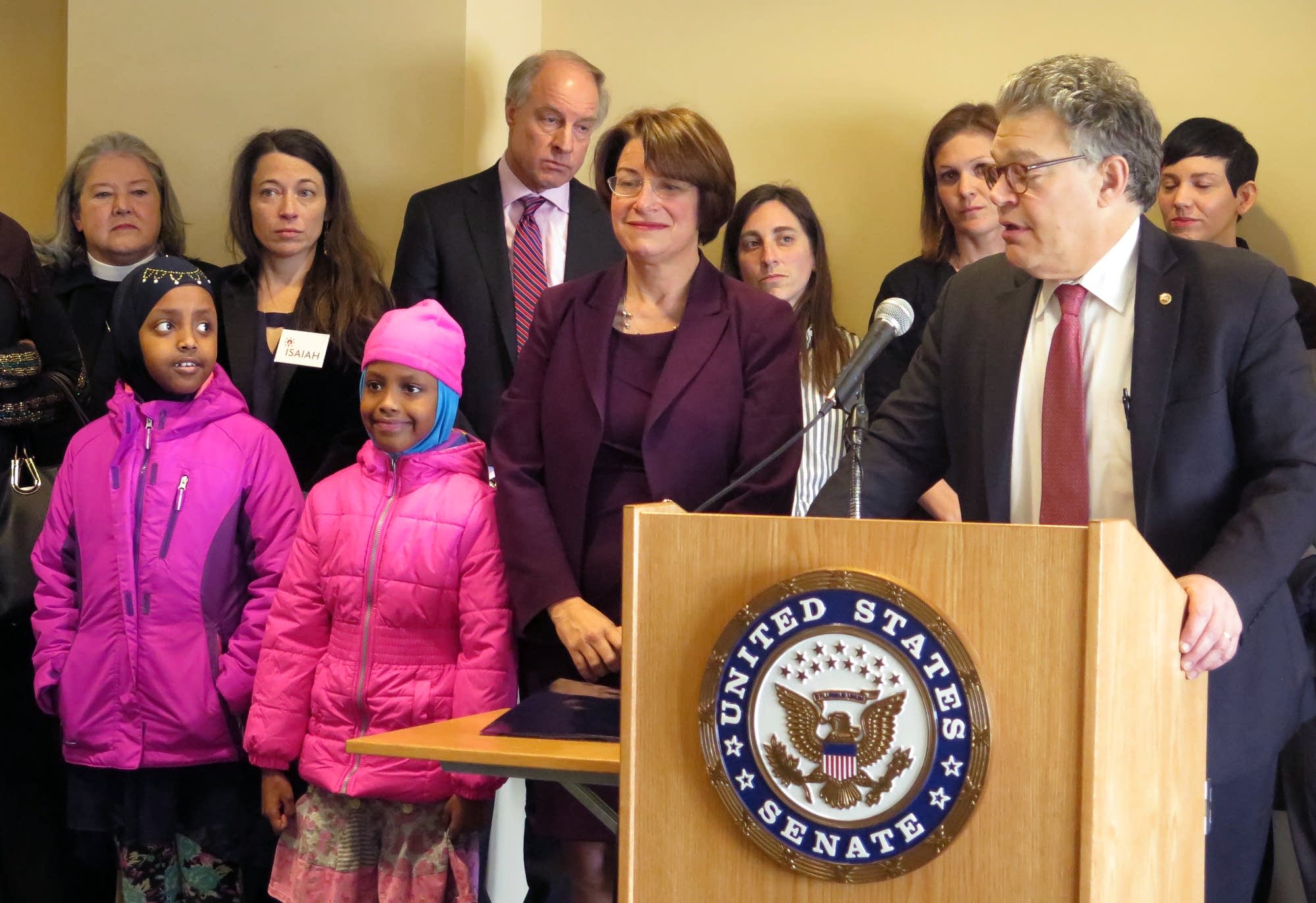 U.S. Senators Al Franken and Amy Klobuchar speak against Trump's order.