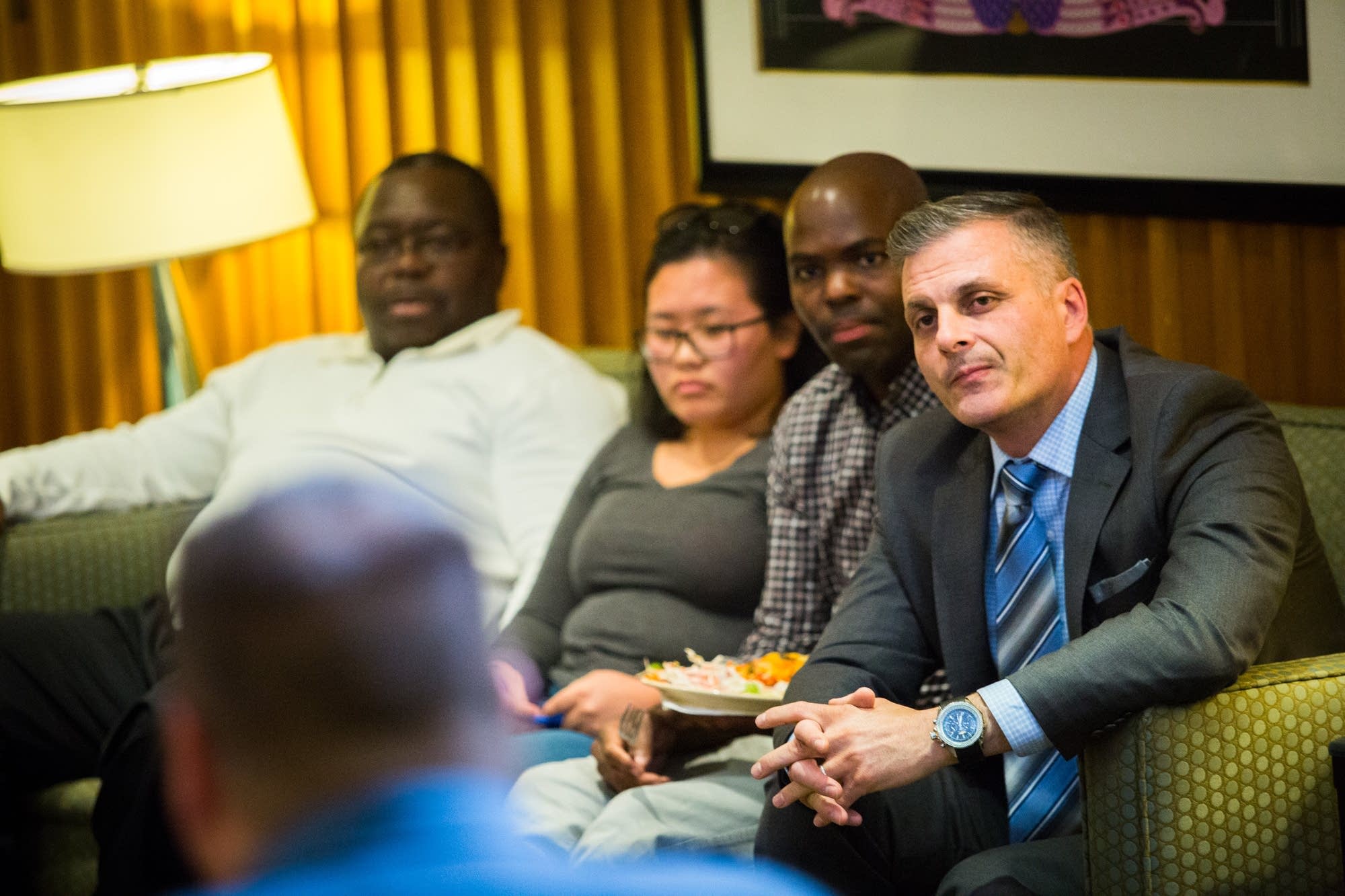 St. Paul Police Deputy Chief Paul Iovino listens.