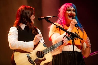 Two people performing on stage