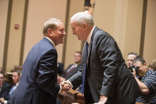 Gov. Dayton, right, greets Doug Kelley, representing the legislature.