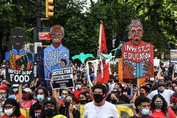 People begin a march out of a protest encampment on June 25, 2020 in a park near City Hall in New York City.  