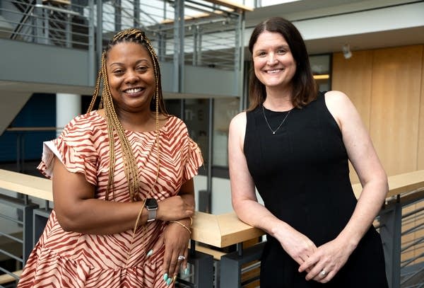 two women posing for a portrait
