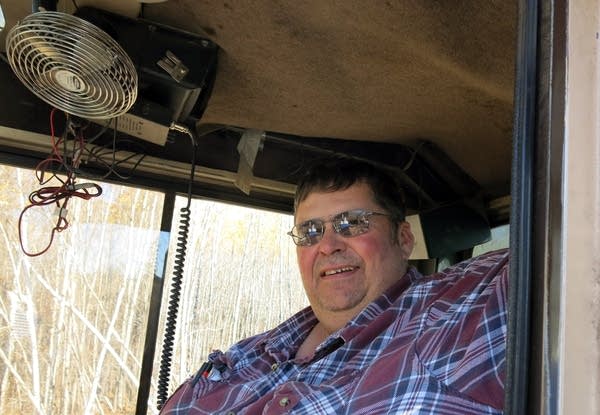 Duane White sits in the cab of his Barko Slasher.