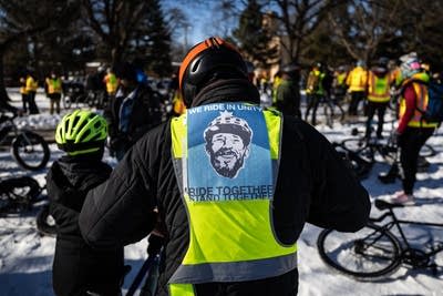 A person wears a sign