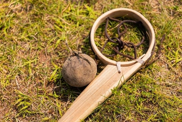 a stick and ball
