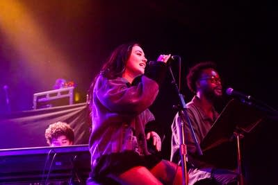 mati's backup singers performing on stage