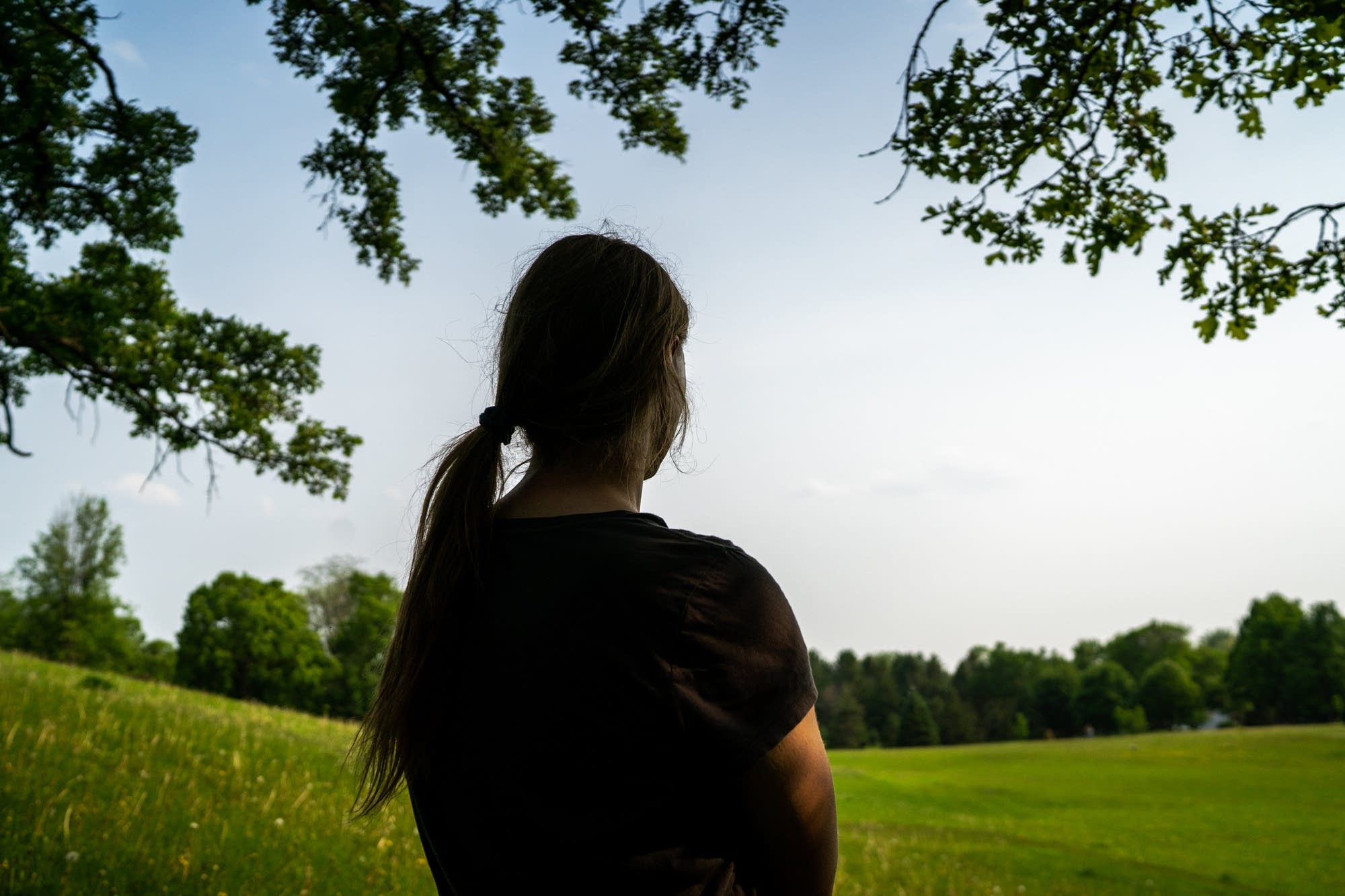 Alice stands for a portrait at Theodore Wirth Park.