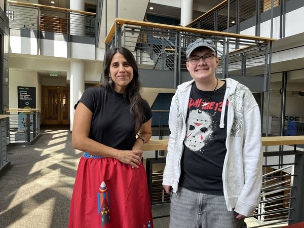 Two people pose for a photograph.