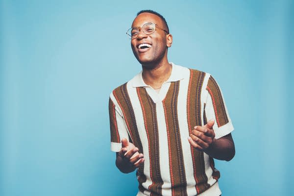 A man performs in a promotional photo.