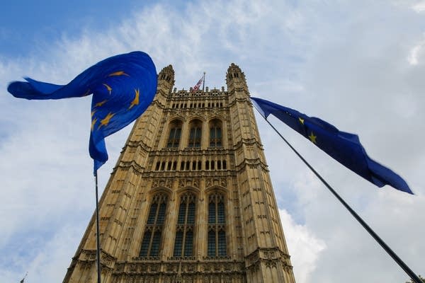 European flags are seen fluttering outside the British Houses of Parliament in Westminster. (Photo: Getty Images)