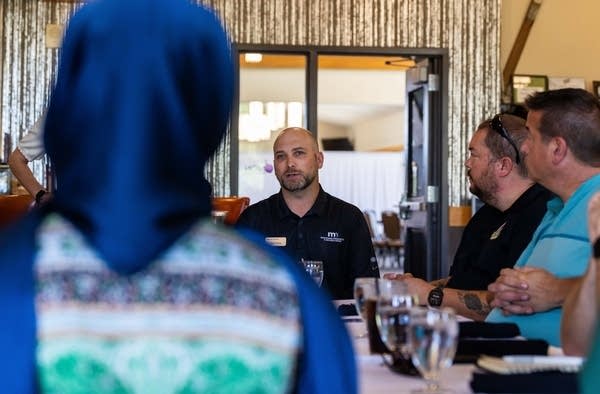 A group talks while at a lunch.