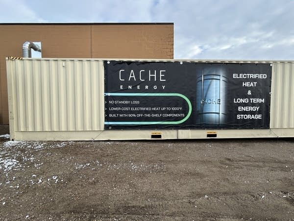 A large metal container with a banner reading 'electrified heat & long-term energy storage'