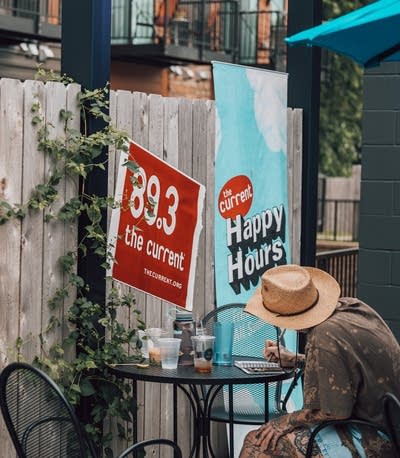 The Current Happy Hour signage 